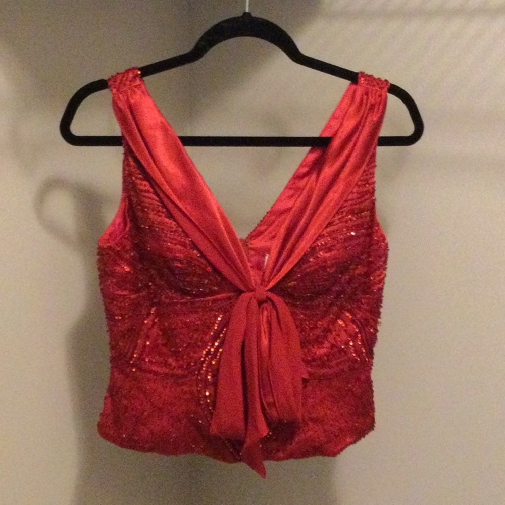 The holidays are coming! This as a Beautiful fully beaded red top.